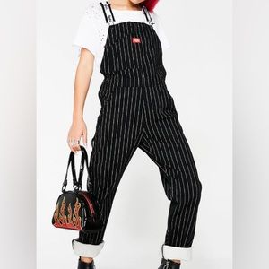 Dickies overalls. White straps are adjustable with stretchy material.